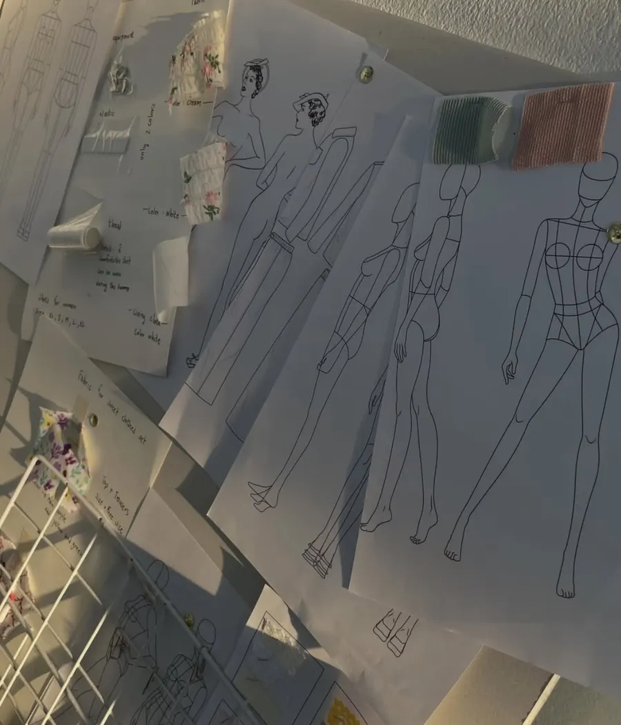 Fashion sketches and swatches on the design desk