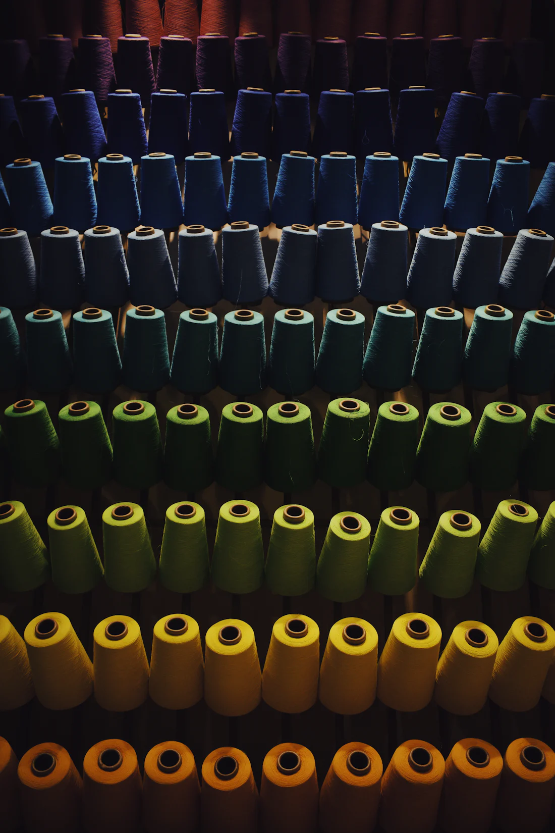Rows of thread spools in many colours