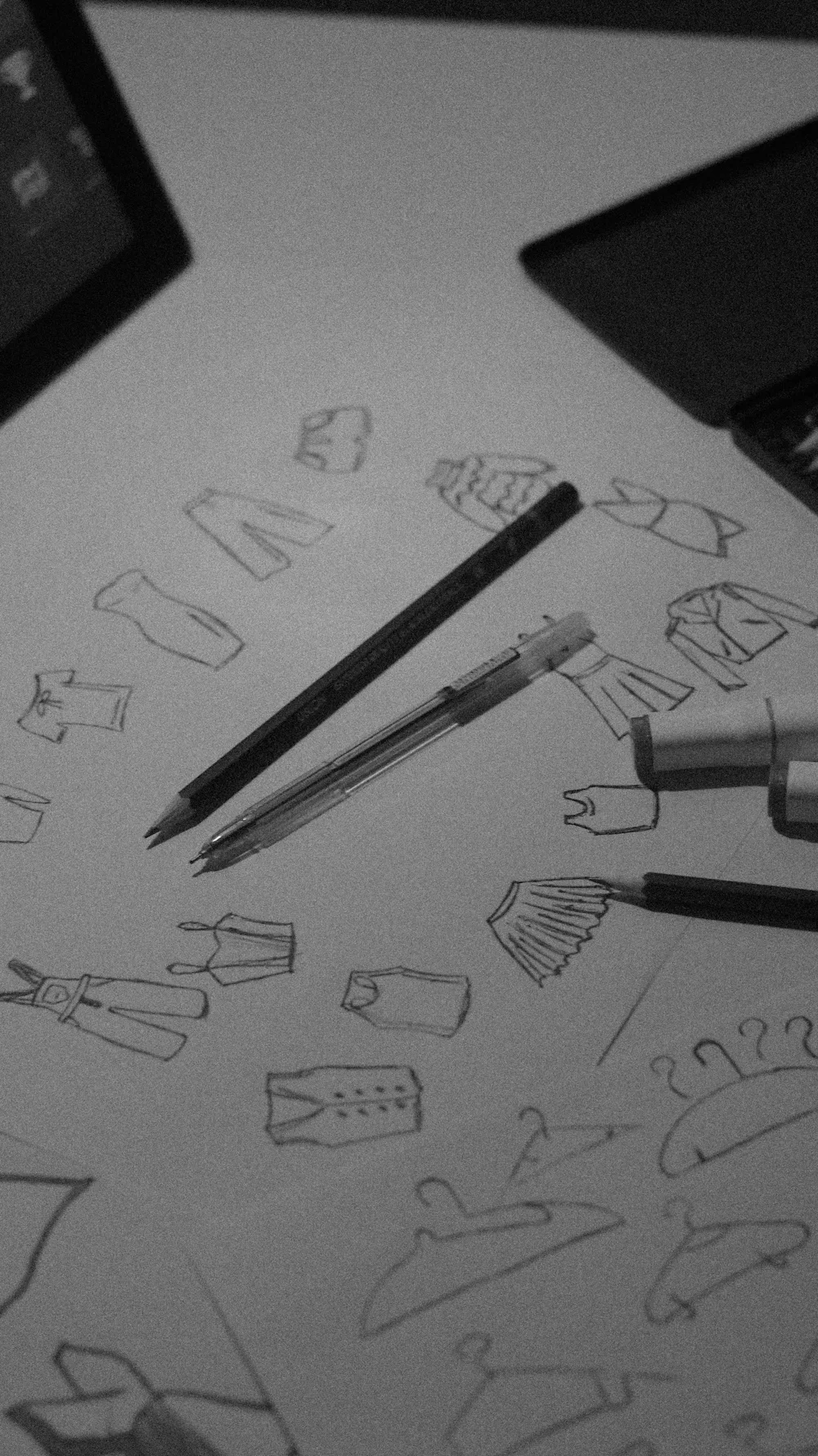 Garment sketches on paper with pens