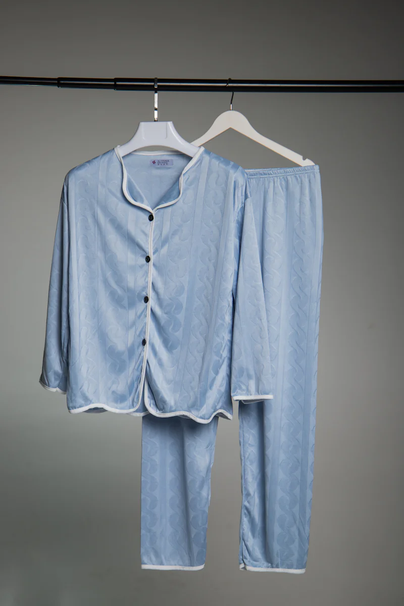 Blue pyjama shirt on a hanger