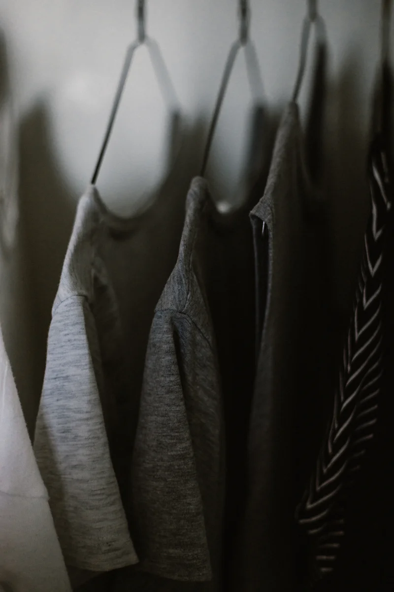 Grey athletic T-shirts on hangers